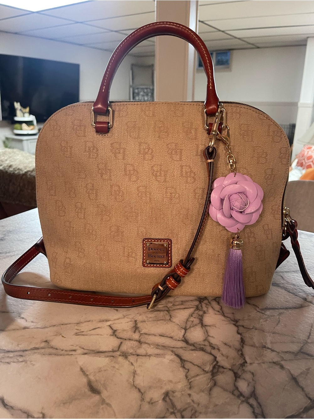 Dooney & Bourke Beige Satchel with Brown Trim and Lilac Flower Charm